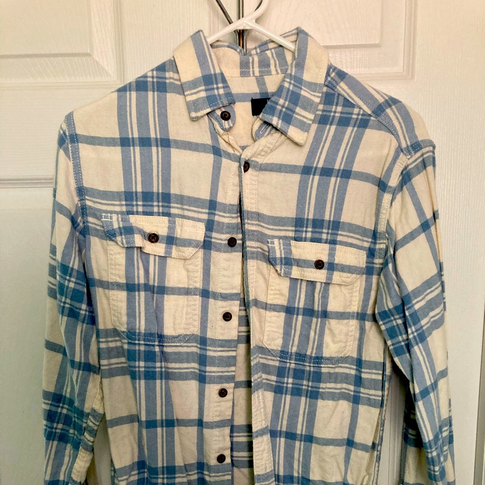 Light blue/white flannel.